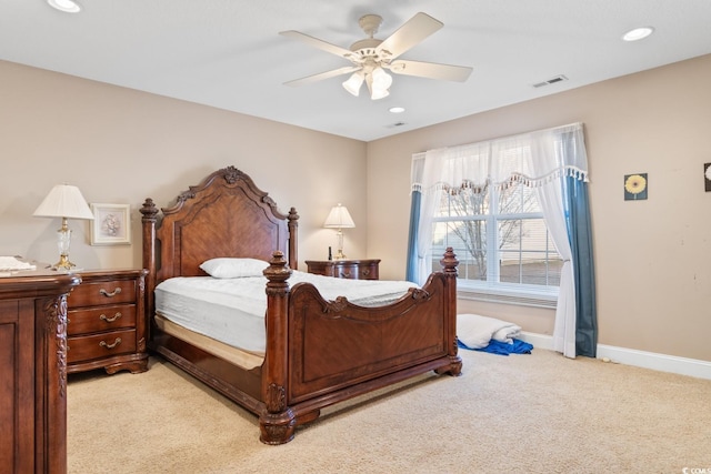 bedroom with light carpet and ceiling fan