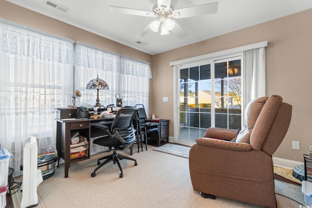 office with carpet and ceiling fan