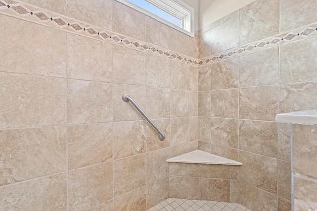 bathroom with tiled shower