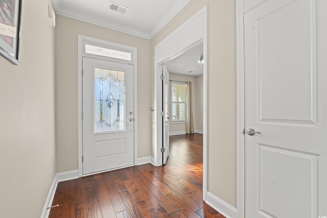 foyer with dark hardwood / wood-style floors and ornamental molding