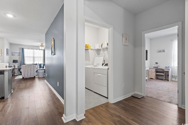 hallway featuring washer and clothes dryer and dark hardwood / wood-style flooring