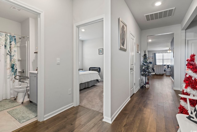 corridor with dark wood-type flooring