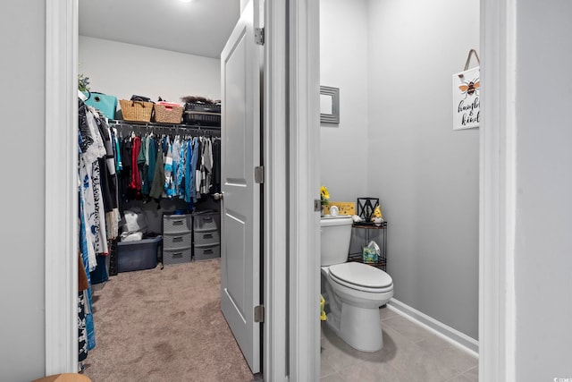 bathroom featuring tile patterned floors and toilet