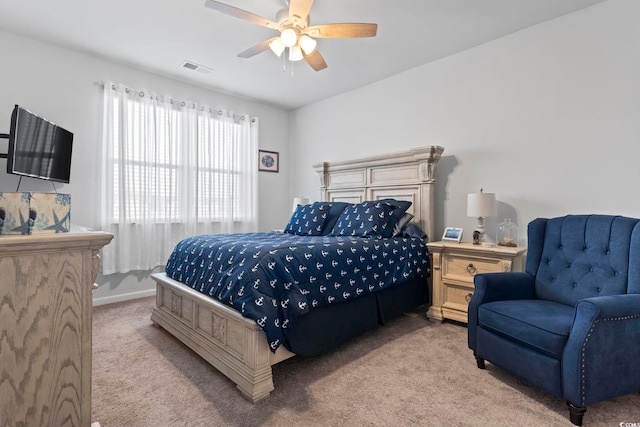 bedroom with light carpet and ceiling fan