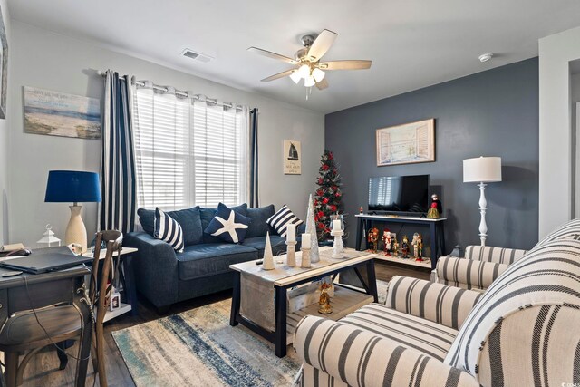 living room with ceiling fan and wood-type flooring