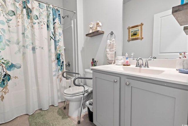 bathroom featuring tile patterned floors, a shower with curtain, vanity, and toilet