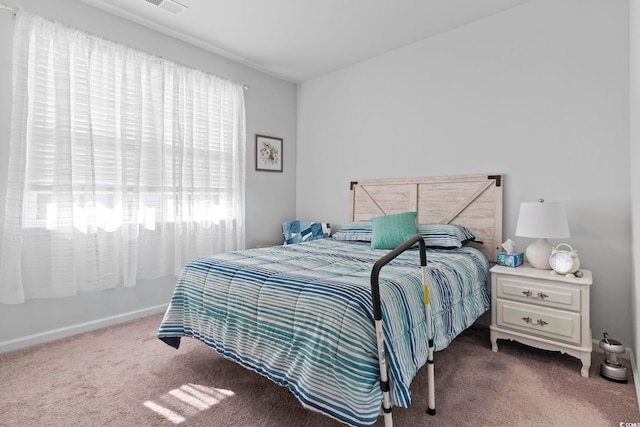 bedroom with dark carpet