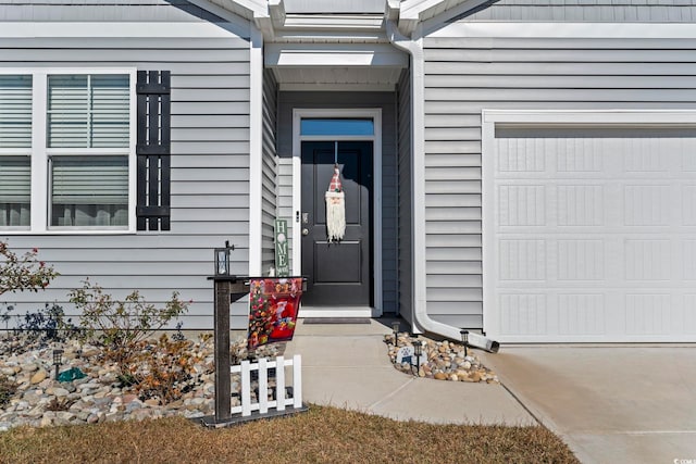 doorway to property featuring a garage