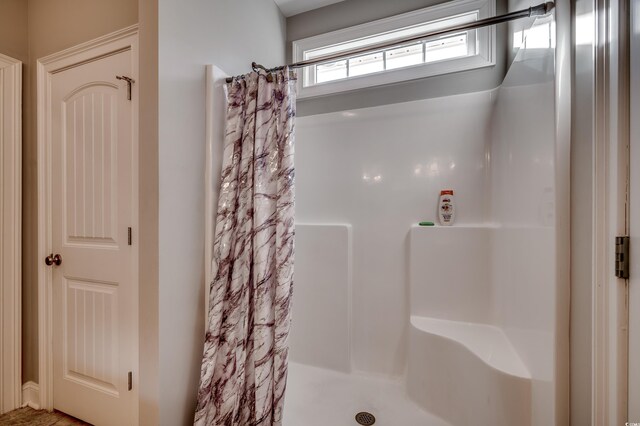 bathroom with curtained shower