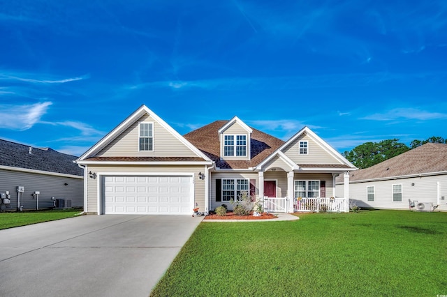 view of front of property featuring central AC unit, a garage, covered porch, and a front lawn