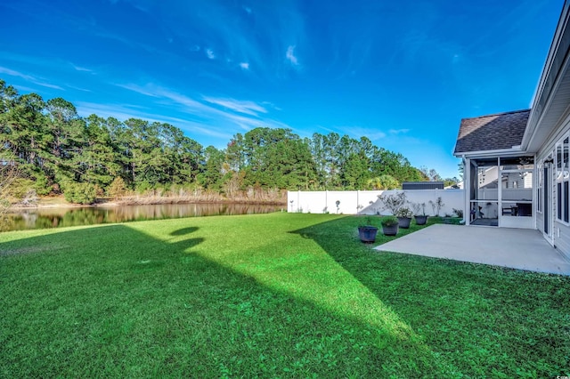 view of yard featuring a patio area and a water view