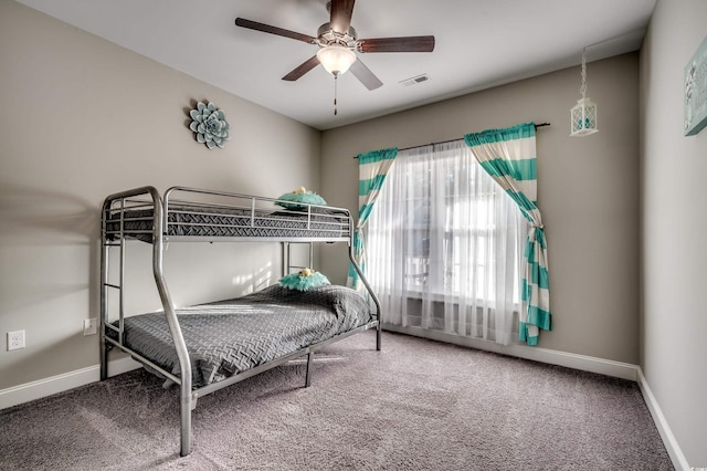 bedroom with ceiling fan and carpet floors