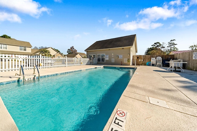 view of swimming pool with a patio area