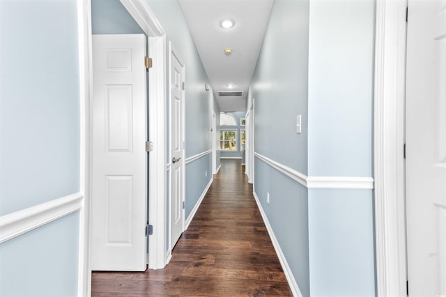 hall with dark hardwood / wood-style flooring