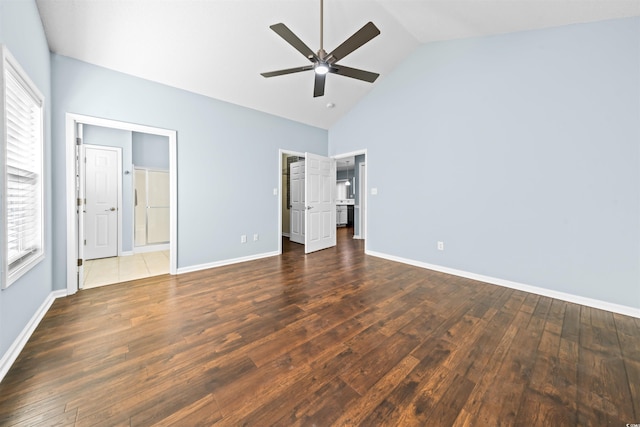 unfurnished bedroom featuring ceiling fan, dark wood-type flooring, and high vaulted ceiling