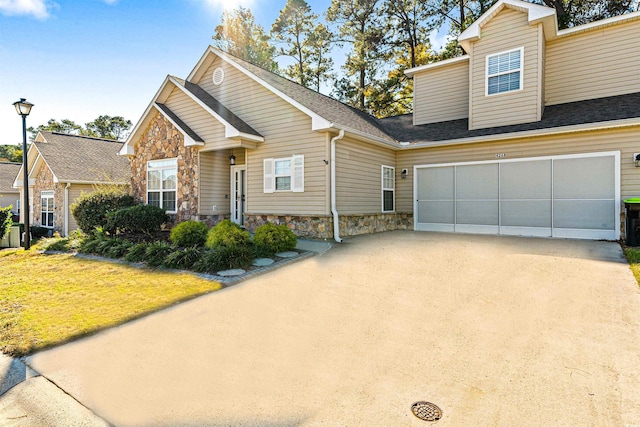 view of front facade with a front yard and a garage