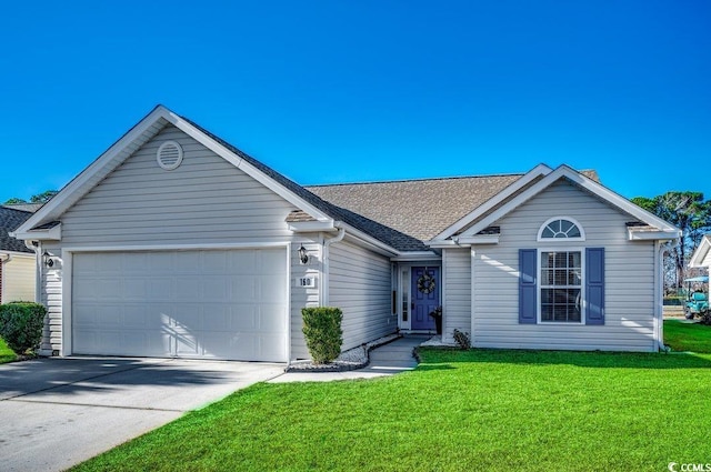 ranch-style house featuring a garage and a front yard