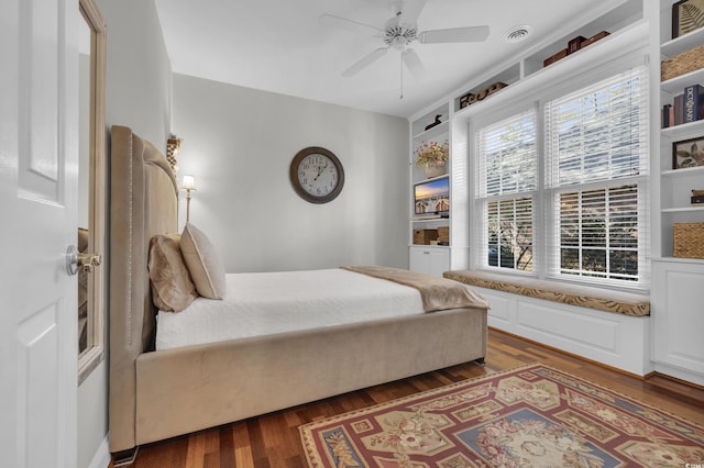 bedroom featuring ceiling fan and dark hardwood / wood-style flooring