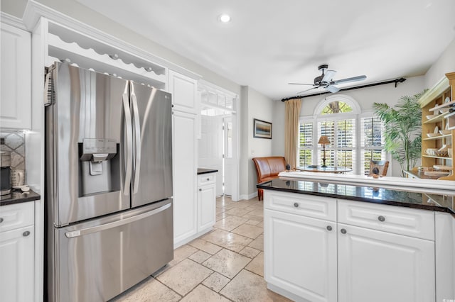 kitchen featuring white cabinetry, stainless steel fridge, and ceiling fan