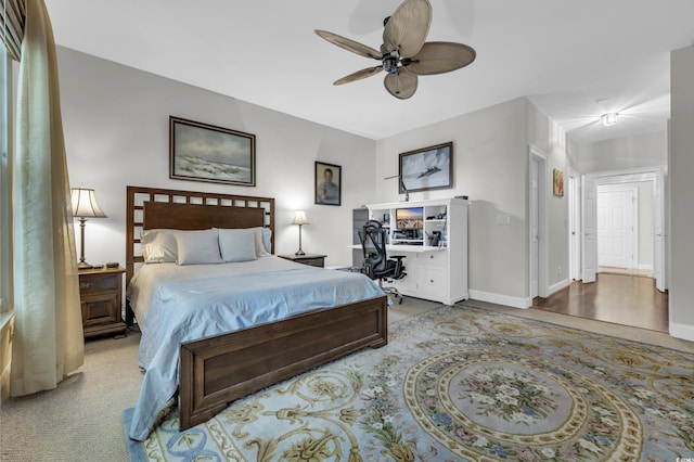 bedroom with ceiling fan and carpet floors