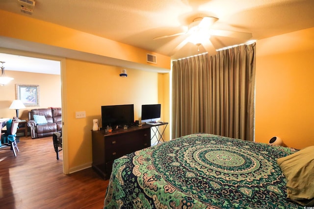 bedroom with wood-type flooring and ceiling fan