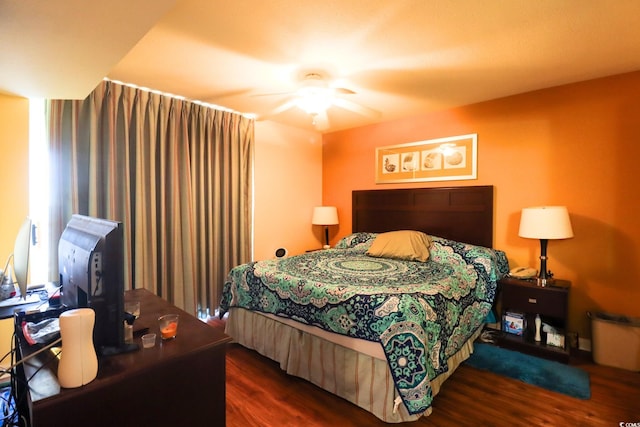 bedroom featuring ceiling fan and dark hardwood / wood-style flooring