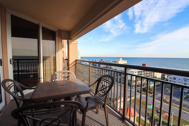 balcony with a beach view and a water view