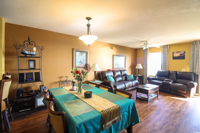 dining area featuring ceiling fan and dark hardwood / wood-style floors