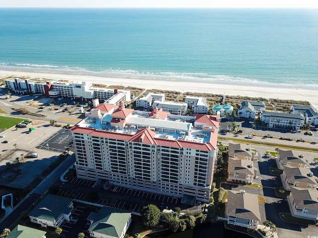 drone / aerial view featuring a view of the beach and a water view