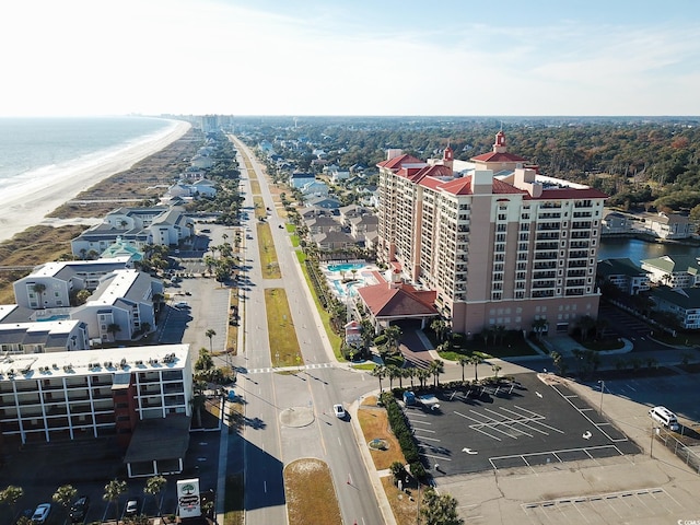 bird's eye view featuring a water view and a view of the beach