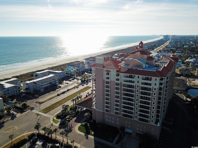 bird's eye view featuring a water view and a view of the beach