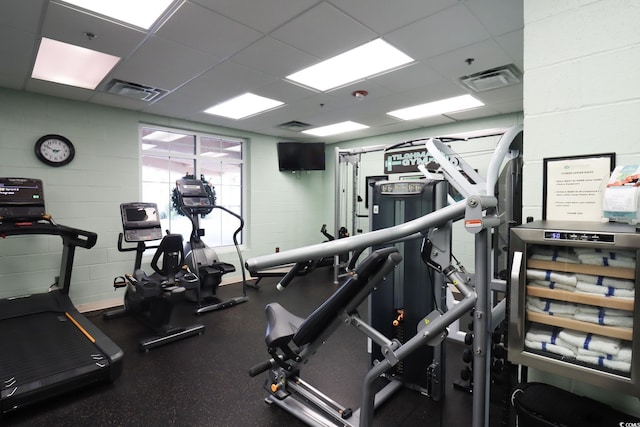 exercise room with a drop ceiling