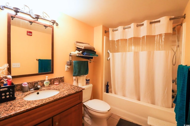 full bathroom with tile patterned flooring, vanity, toilet, and shower / bath combo with shower curtain