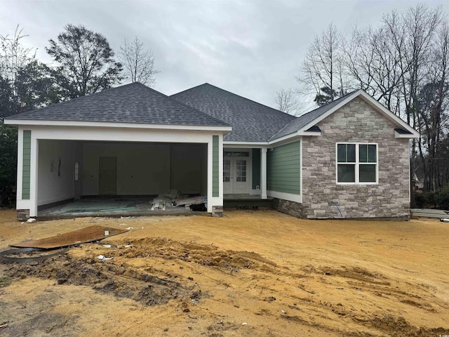 rear view of property with french doors