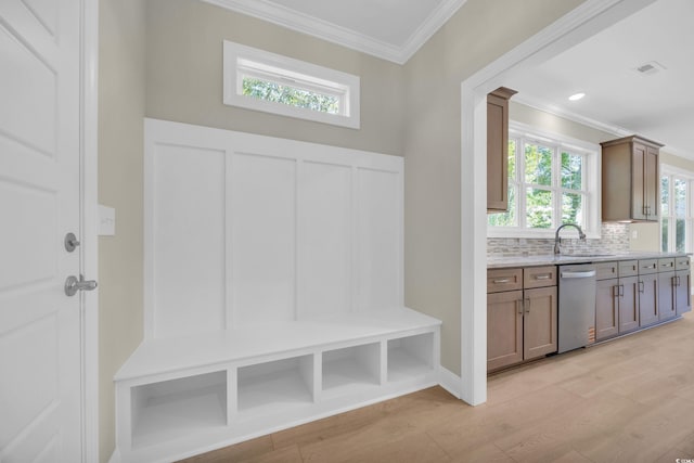 2515 Saint Andrews Dr, Little River, SC 29566 - mudroom featuring crown molding, light wood-style flooring, and a sink