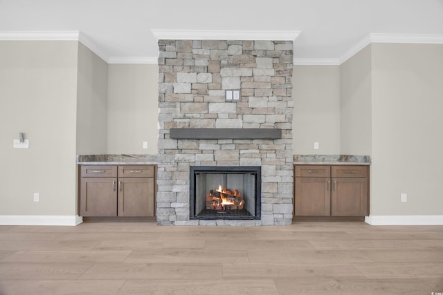 2515 Saint Andrews Dr, Little River, SC 29566 - unfurnished living room with ornamental molding, light wood-style flooring, a fireplace, and baseboards