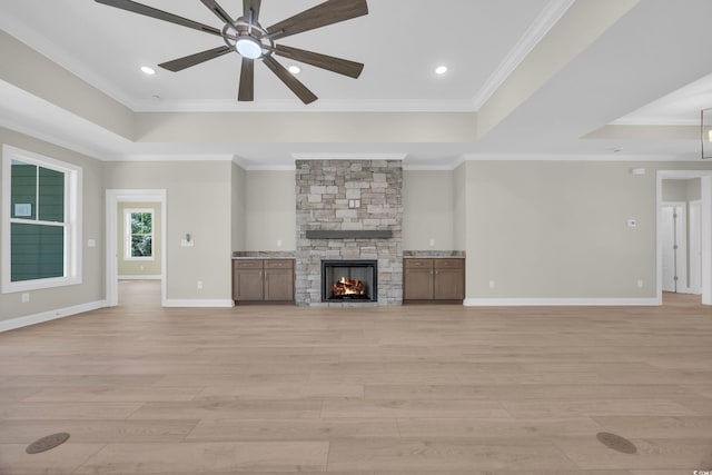 2515 Saint Andrews Dr, Little River, SC 29566 - unfurnished living room featuring a tray ceiling, ceiling fan, light wood-style flooring, ornamental molding, and recessed lighting