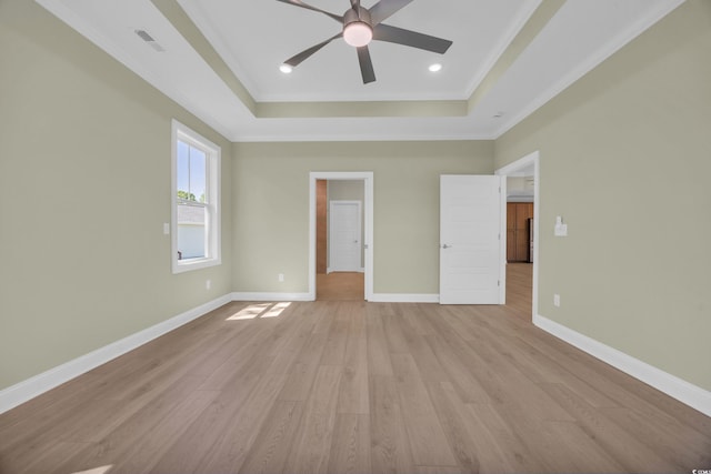 2515 Saint Andrews Dr, Little River, SC 29566 - unfurnished bedroom with a tray ceiling, light wood-type flooring, ornamental molding, baseboards, and recessed lighting
