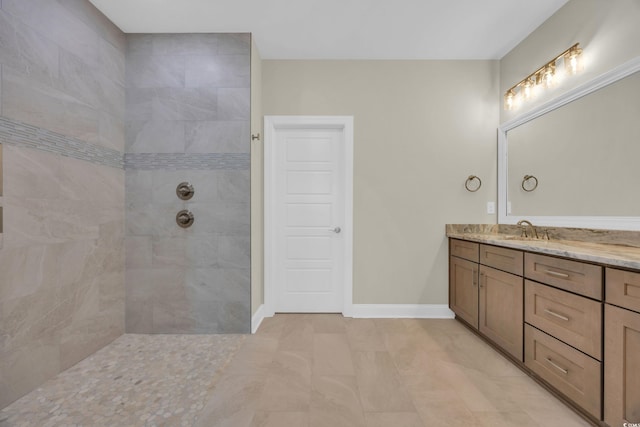 2515 Saint Andrews Dr, Little River, SC 29566 - full bathroom with vanity, baseboards, and tiled shower
