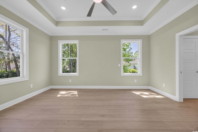 2515 Saint Andrews Dr, Little River, SC 29566 - empty room featuring a tray ceiling, ornamental molding, plenty of natural light, and recessed lighting
