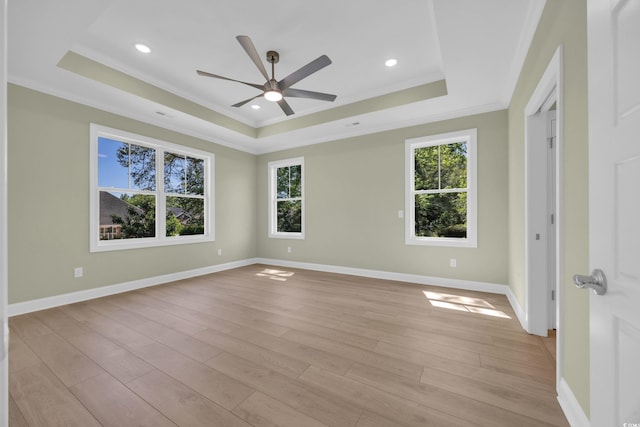 2515 Saint Andrews Dr, Little River, SC 29566 - spare room with a tray ceiling, ornamental molding, healthy amount of natural light, light wood finished floors, and recessed lighting