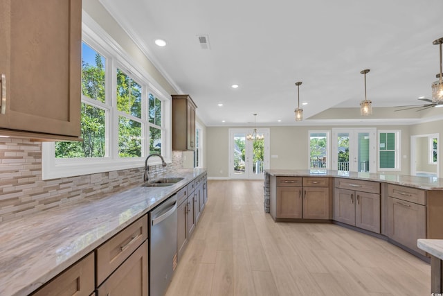 2515 Saint Andrews Dr, Little River, SC 29566 - kitchen featuring stainless steel dishwasher, a sink, light wood-style floors, tasteful backsplash, and recessed lighting