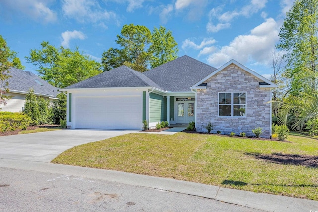 2515 Saint Andrews Dr, Little River, SC 29566 - view of front of house with french doors, an attached garage, a front yard, stone siding, and driveway