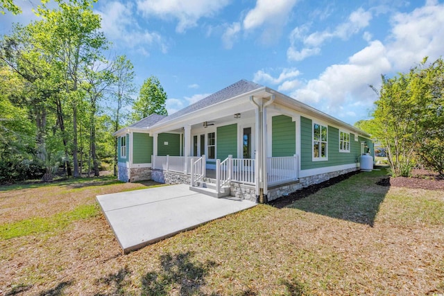 2515 Saint Andrews Dr, Little River, SC 29566 - view of front of property with covered porch and a front lawn