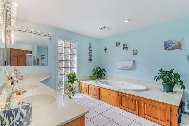 1692 S Morgan Ave, Andrews, SC 29510 - bathroom with double vanity, tile patterned floors, and a garden tub