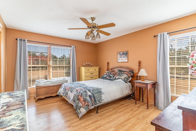 1692 S Morgan Ave, Andrews, SC 29510 - bedroom featuring wood finished floors, a textured ceiling, and a ceiling fan