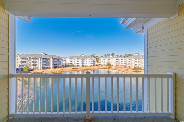 balcony featuring a water view