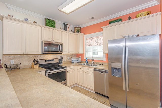 kitchen with light tile patterned flooring, sink, tasteful backsplash, ornamental molding, and stainless steel appliances