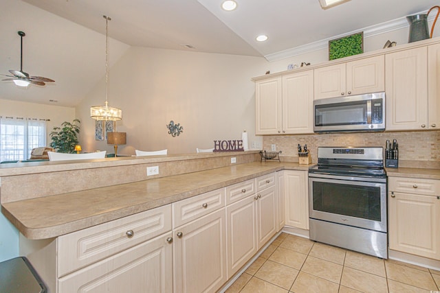 kitchen featuring pendant lighting, light tile patterned floors, stainless steel appliances, and kitchen peninsula