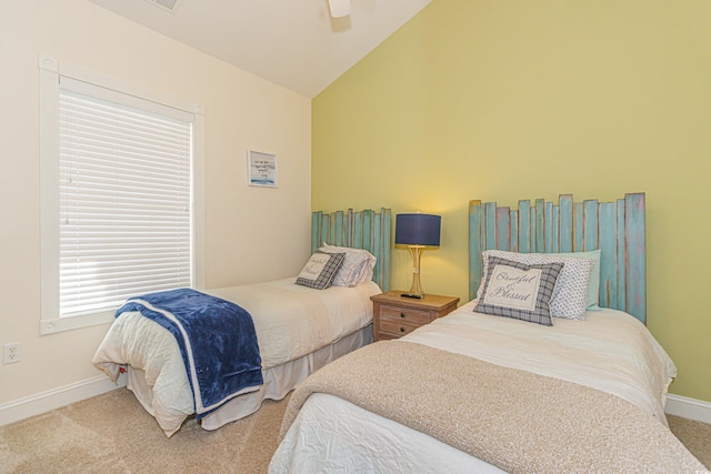 carpeted bedroom featuring vaulted ceiling and ceiling fan